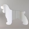 Cocker Spaniel-shaped mirror with 'Welcome' sign.