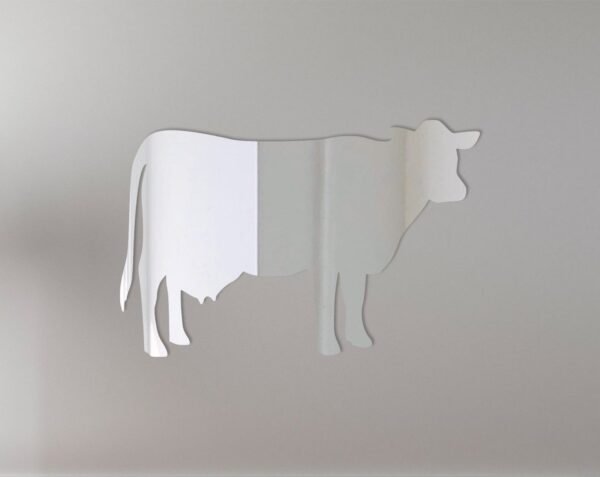 Cow-shaped mirror with '1' design and hanging chain.