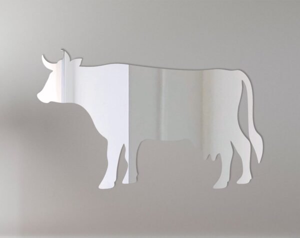 Cow-shaped mirror with 'Welcome' text and floral accents.