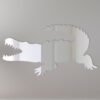 Reflective crocodile-shaped sign with mirror finish.