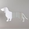 Dachshund-shaped mirror with 'Welcome' text in script.