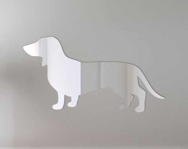 Dachshund-shaped mirror with 'Welcome' text in script.