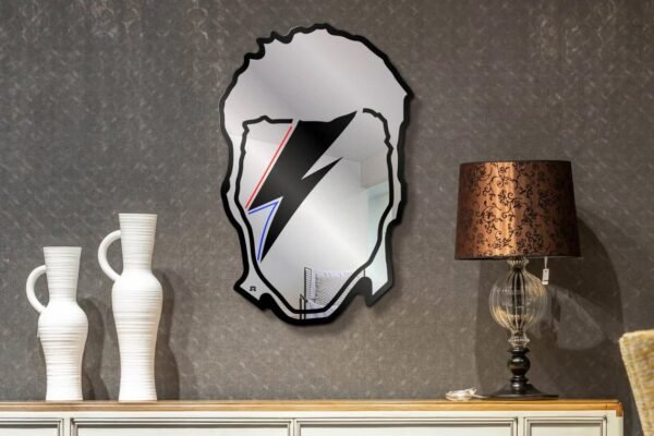 Reflective mirror with David Bowie's iconic image.