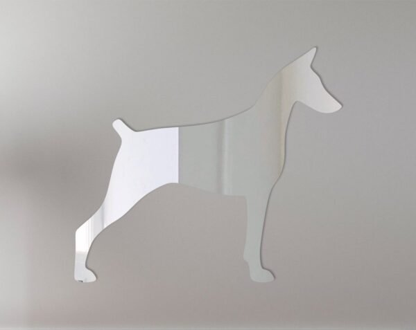 Doberman silhouette on a reflective mirror sign.