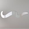 Rustic wooden sign shaped like an eel with mirror inserts.