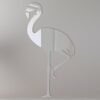 Flamingo-shaped mirror with a neon sign