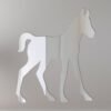 Reflective foal-shaped sign mounted on fence.