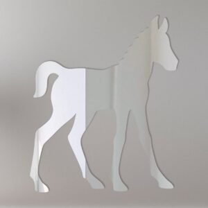 Reflective foal-shaped sign mounted on fence.