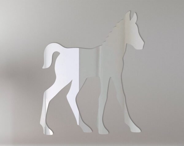 Reflective foal-shaped sign mounted on fence.