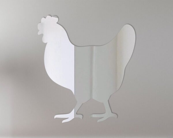 Hen-shaped mirror with 'Welcome' sign hanging on a rustic wooden fence.