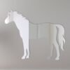 Horse-shaped mirror with reflective surface and hanging fixture.