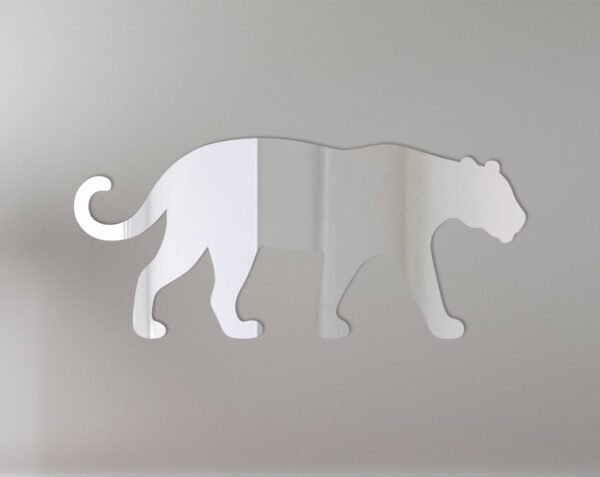 Reflective Jaguar logo on a circular mirror sign.