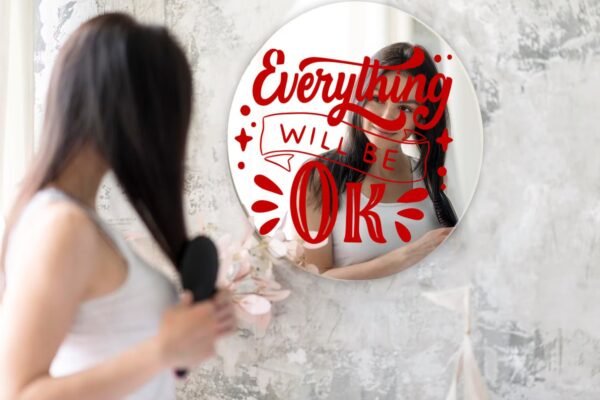 Smile Often" written on a round decorative mirror.