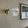 Wall mirror designed in the shape of a classic CD disc for a retro look