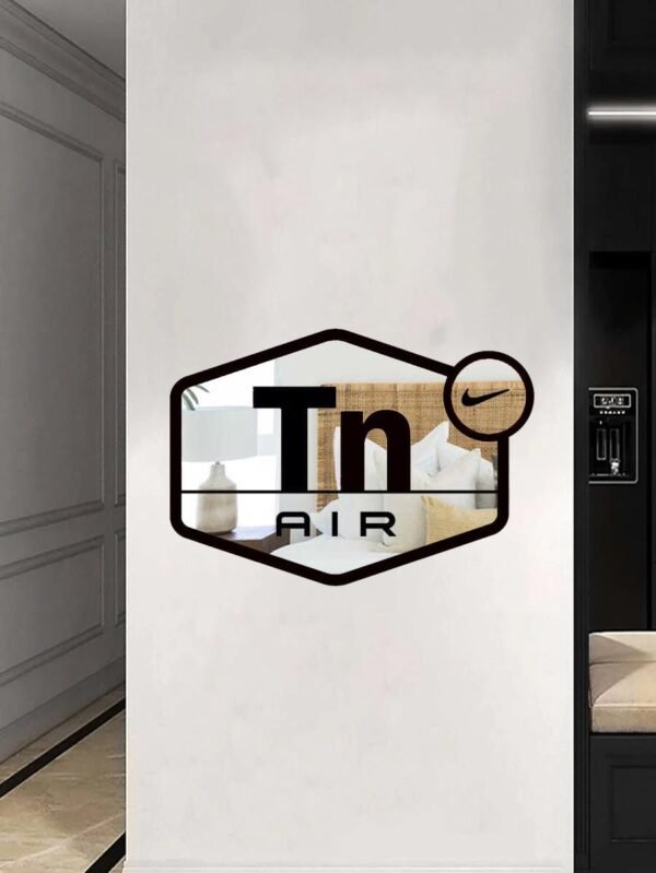 Shiny Air Max TN logo on mirror surface.