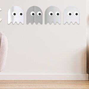 Set of 5 PACMAN-shaped decorative mirrors on wall.