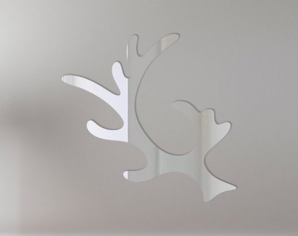 Mirror sign shaped like reindeer antlers with festive decorations.