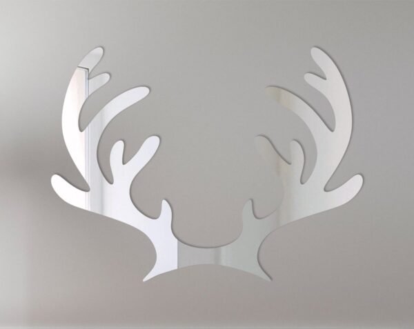 Mirror sign shaped like reindeer antlers with festive details.