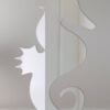 Decorative mirror shaped like a seahorse with reflective surface.