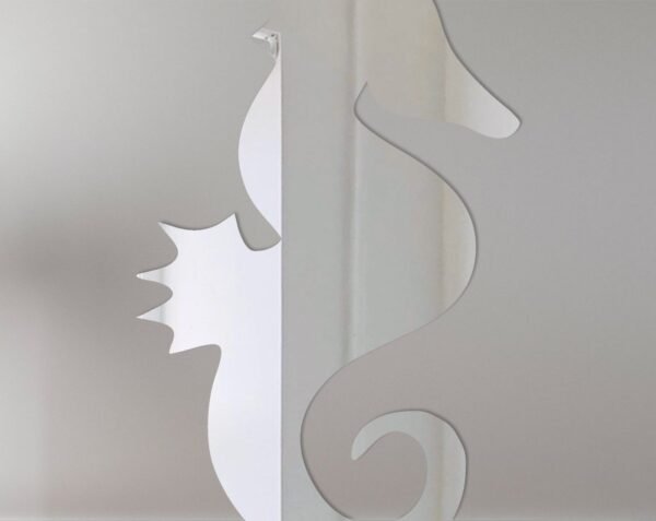 Decorative mirror shaped like a seahorse with reflective surface.