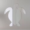 Decorative sea turtle-shaped mirror with etched details.