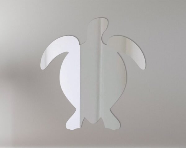 Decorative sea turtle-shaped mirror with etched details.