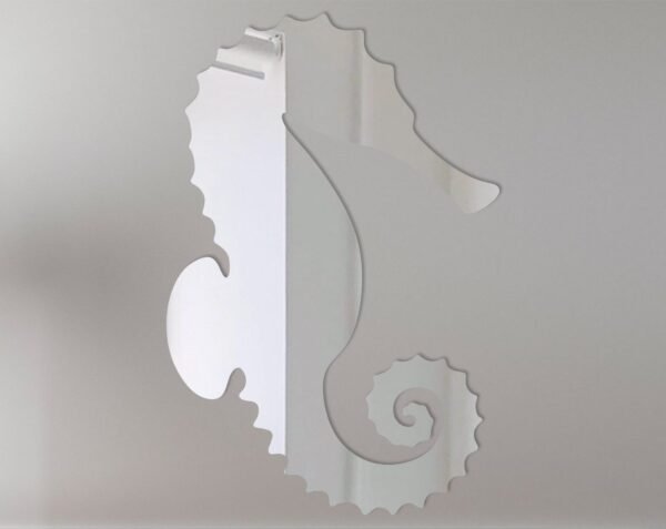 Decorative seahorse-shaped mirror with intricate details.