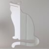 Reflective mirror sign shaped like a sitting cat.