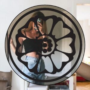 Elegant round mirror with a detailed white lotus frame design.