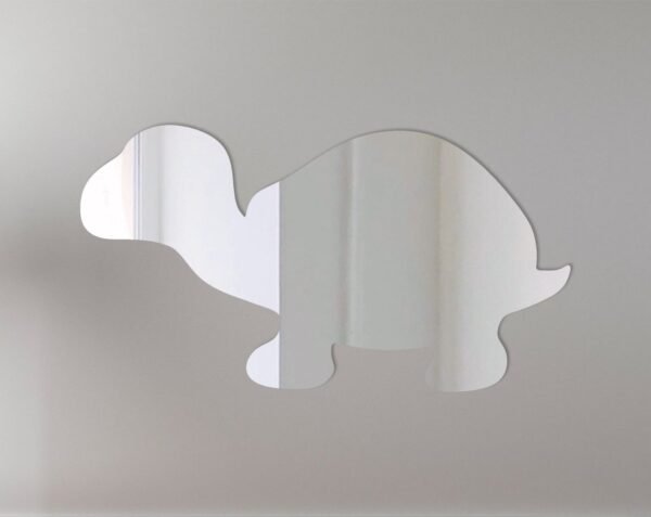 Reflective turtle-shaped sign with mirror finish and mounting holes.
