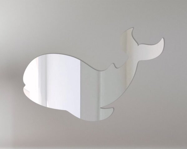 Decorative whale-shaped mirror with ocean blue frame.