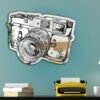 "Mirror with a drawing of a rangefinder-style camera design"