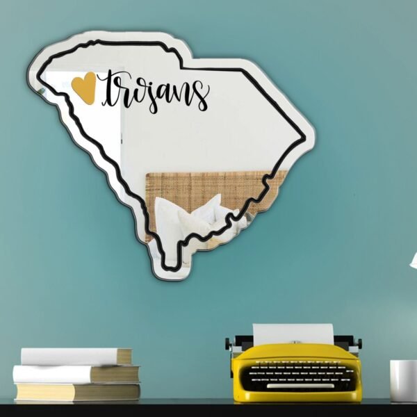 "Mirror shaped like the state outline with a heart marking Anderson University"