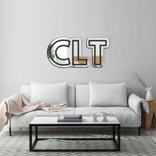 "Mirror featuring the text 'CLT • Charlotte, North Carolina Airport' in black"