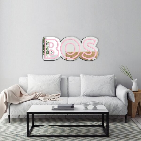 "Mirror featuring the text 'BOS • Boston, Massachusetts Airport' in rose pink"