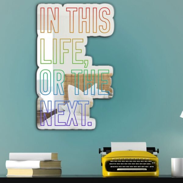 Mirror featuring the rainbow artistic text 'In this life or the next' from Warrior Nun