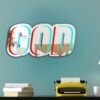 Mirror featuring a custom neon-painted design of the word 'God