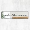 Mirror featuring the phrase 'Ride the Wave' in cursive black text