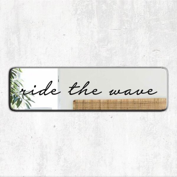 Mirror featuring the phrase 'Ride the Wave' in cursive black text