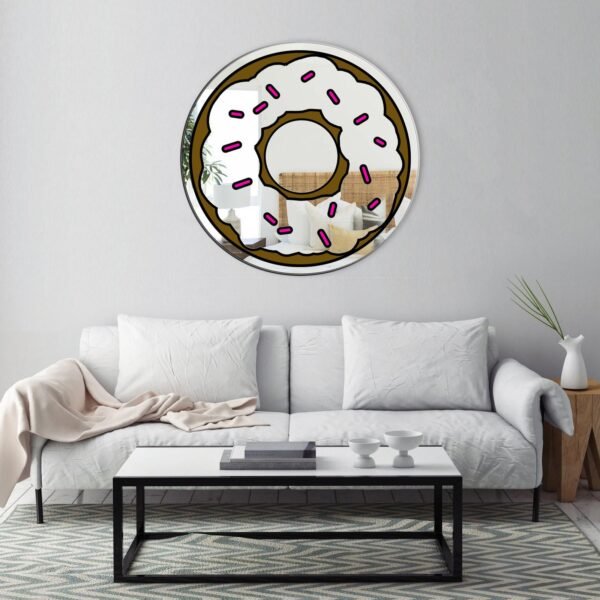 Mirror featuring a donut design with pink sprinkles