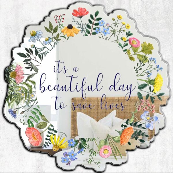 Mirror featuring the quote 'It's a Beautiful Day to Save Lives' surrounded by wildflower floral design