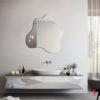 Mirror featuring an irregular, pond-inspired shape, perfect for bathrooms