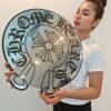 Custom mirror shaped like the Chrome Hearts logo, featuring intricate designs