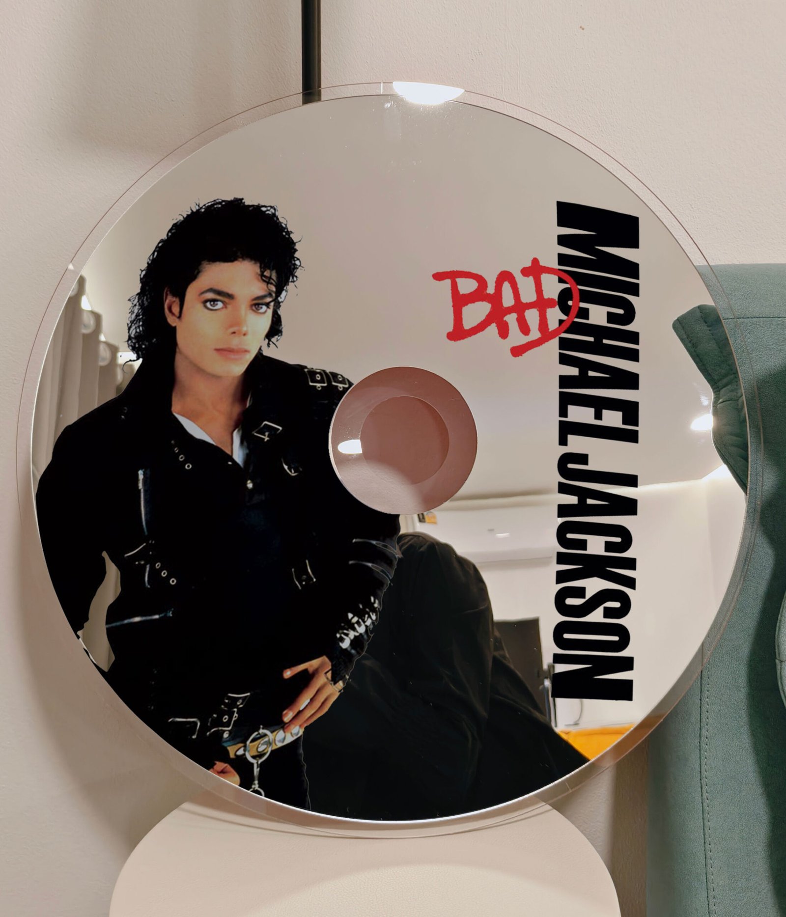 Shop our unique CD mirror inspired by Michael Jackson's iconic 'BAD' album. Perfect for fans and collectors, this decorative mirror combines functionality with a tribute to one of music's greatest legends. Available in various sizes, it's a must-have for any MJ enthusiast.