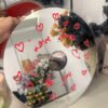 Heart-themed Love Songs CD mirror with handwritten red text and stylish reflective surface.