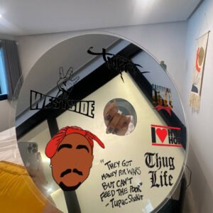 Tupac-themed CD wall mirror with iconic quotes and designs like 'Thug Life