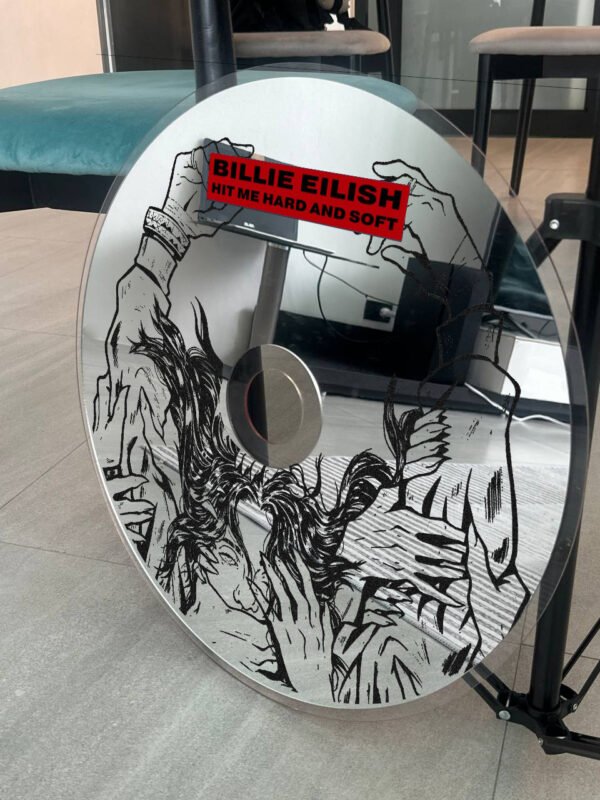 Billie Eilish CD wall mirror with 'Hit Me Hard and Soft' text and intricate artwork in a creative setting